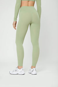 Базові легінси оливкового кольору with high waist, soft elastic fabric, flat seams, and hidden pocket for active comfort.